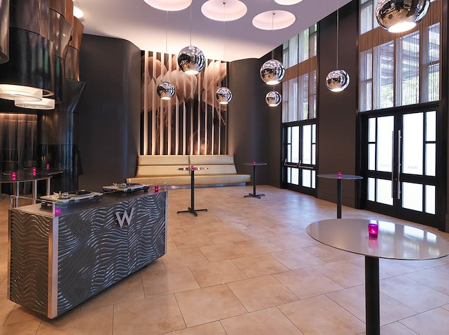 Event space with tables and DJ booth set up